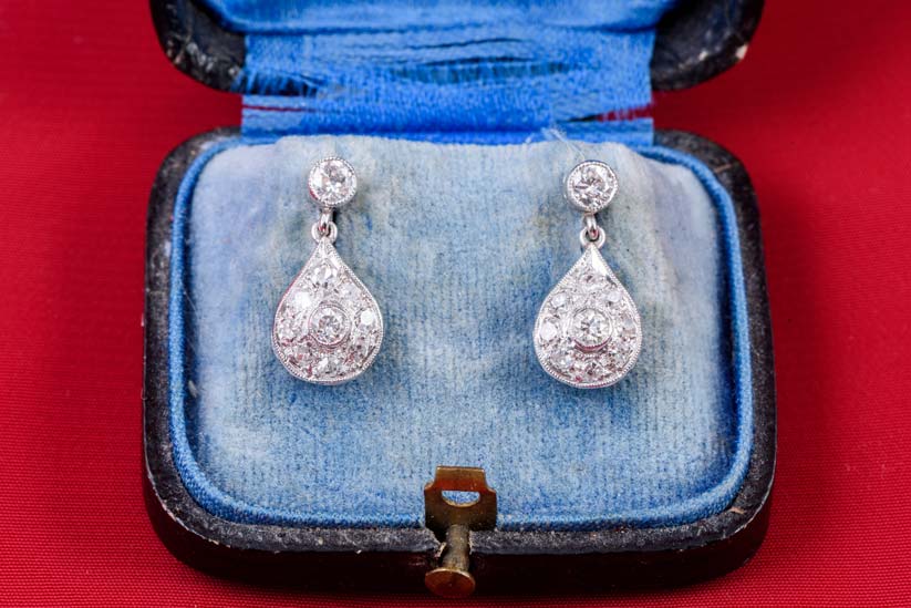 A pair of Art Deco platinum and diamond earring