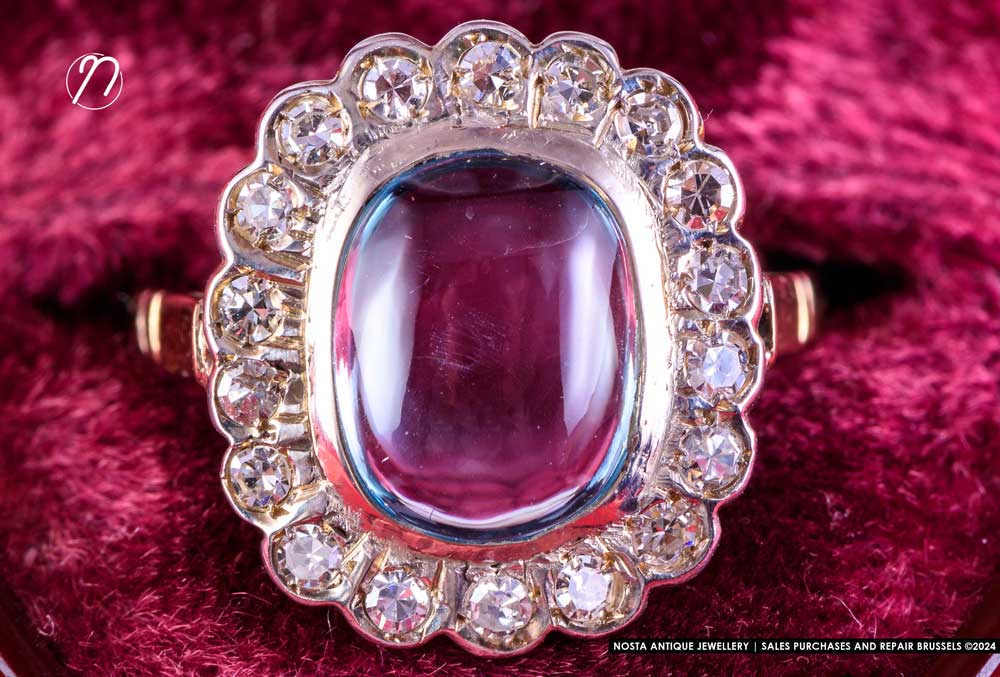 18k yellow gold and platinum ring set with 6 fine sapphires and 18 'rose cut' diamonds. Era: early 20th century.