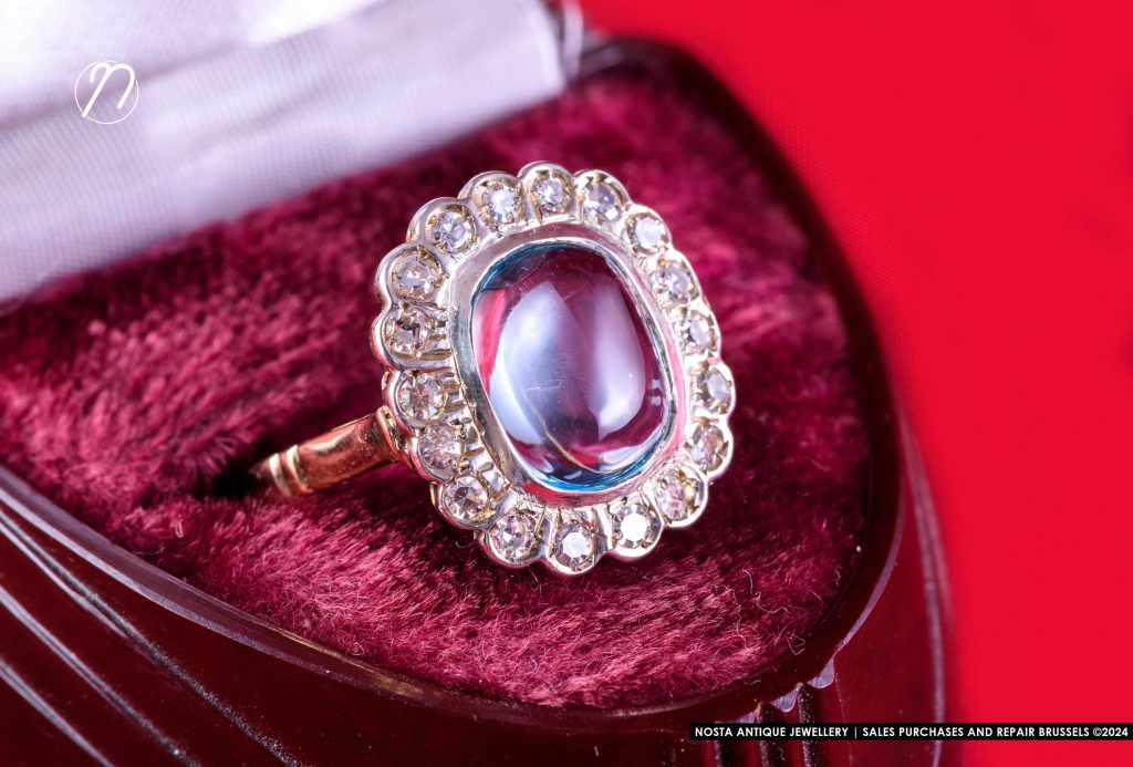 18k yellow gold and platinum ring set with 6 fine sapphires and 18 'rose cut' diamonds. Era: early 20th century.